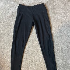 Black workout leggings with mesh on knees